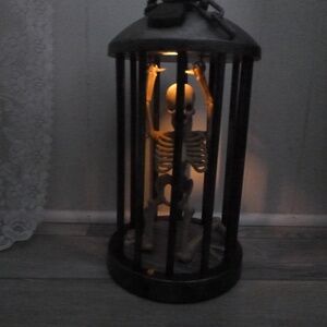 GEMMY LIGHTED ANIMATED SKELETON IN CAGE w/BONUS HALLOWEEN STRING LIGHTS